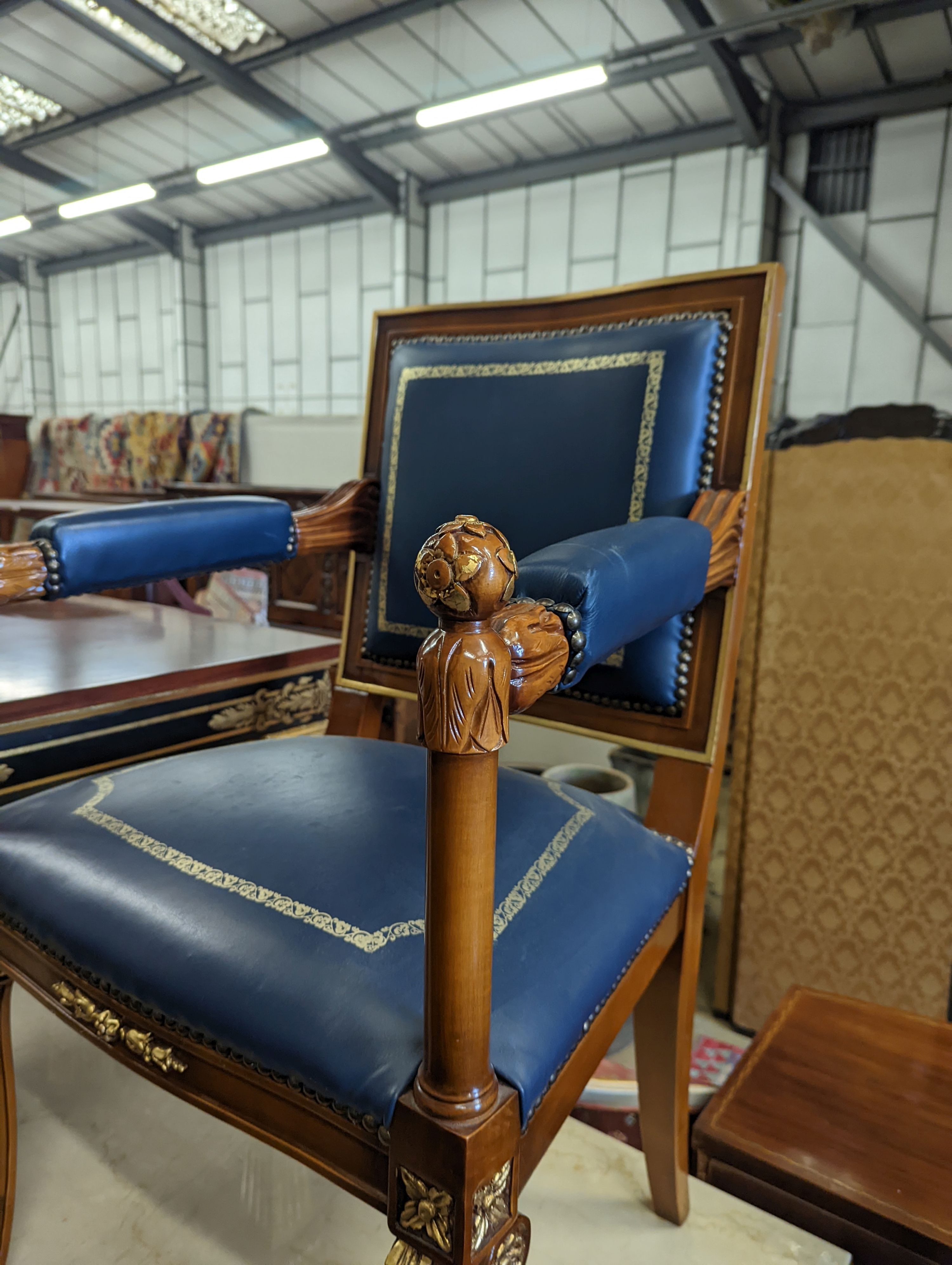 An Empire style parcel gilt mahogany elbow chair together with a similar square low occasional table, width 70cm, height 55cm